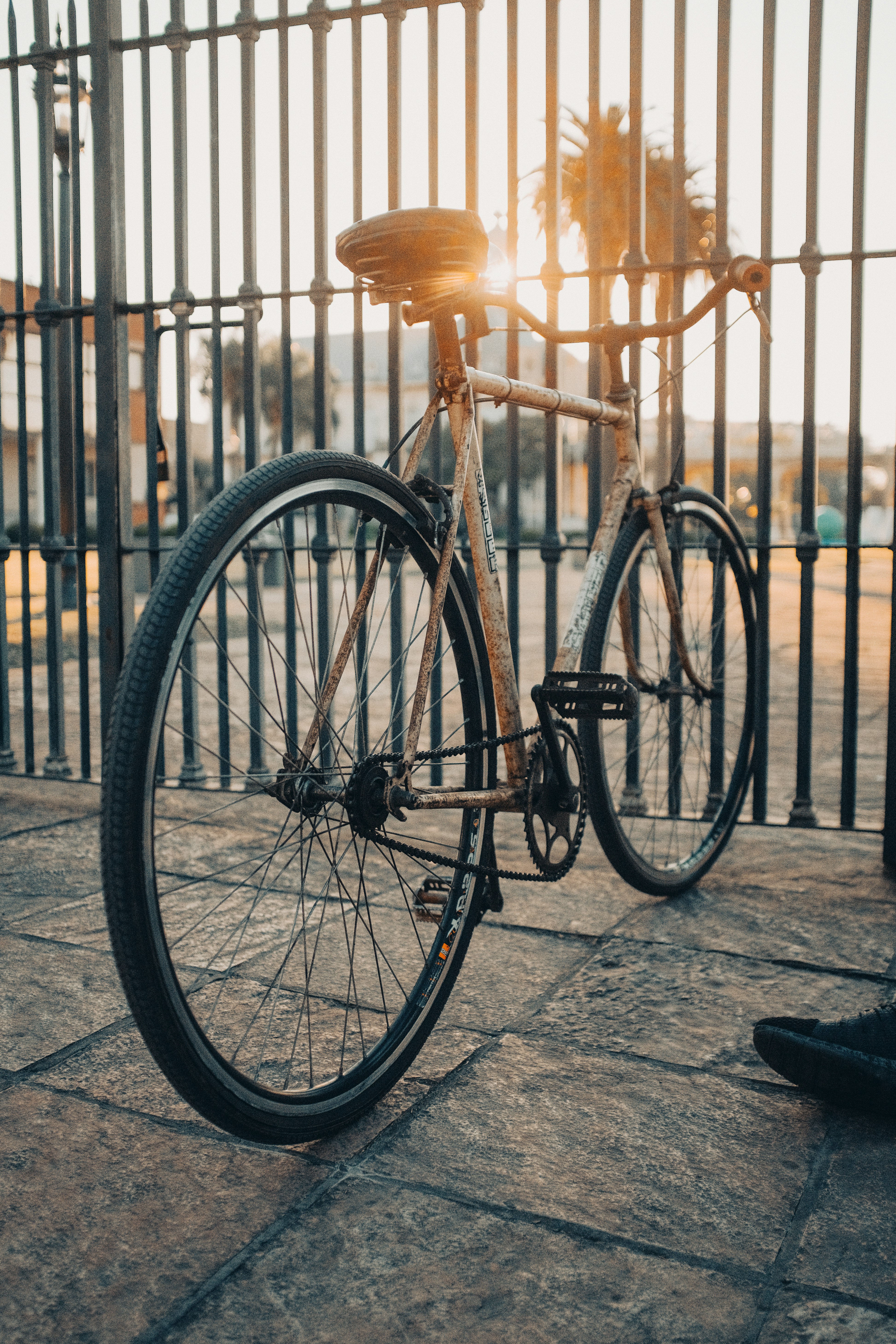 black bicycle parked on sidewalk during daytime